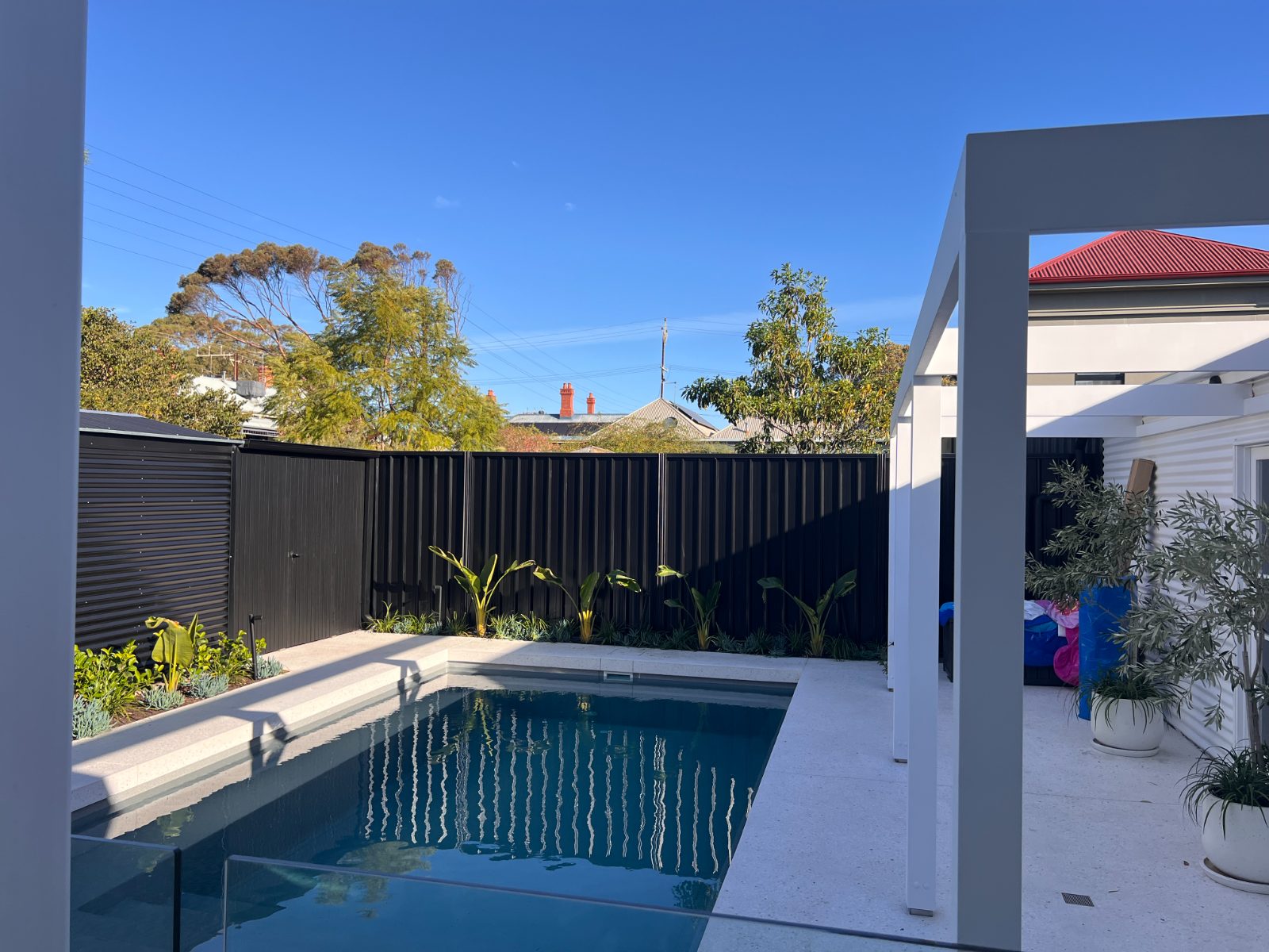 Pool surrounds, natural stone — real AOI job